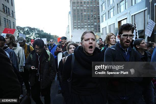 Thousands of anti-Donald Trump protesters, including many pro-immigrant groups, hold a demonstration along 5th Avenue as New Yorkers react to the...