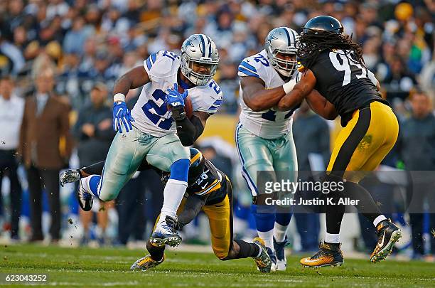 Ezekiel Elliott of the Dallas Cowboys rushes against the Pittsburgh Steelers in the first quarter during the game at Heinz Field on November 13, 2016...
