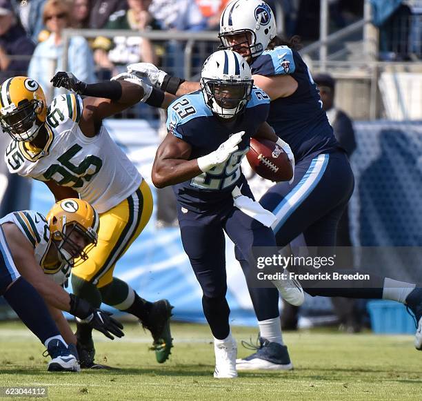 Running back DeMarco Murray of the Tennessee Titans rushes against Datone Jones of the Green Bay Packers during the first half at Nissan Stadium on...