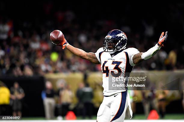 Denver Broncos strong safety T.J. Ward recovers a fumble in the second half at the New Orleans Saints at the Mercedes-Benz Superdome New Orleans, LA...