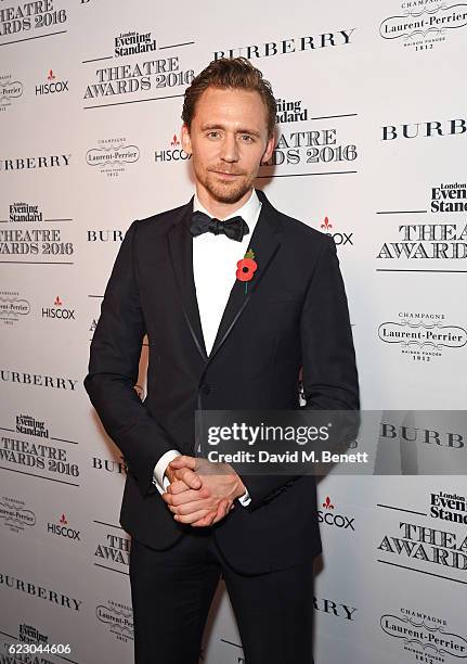 Tom Hiddleston poses in front of the winners boards at The 62nd London Evening Standard Theatre Awards, recognising excellence from across the world...