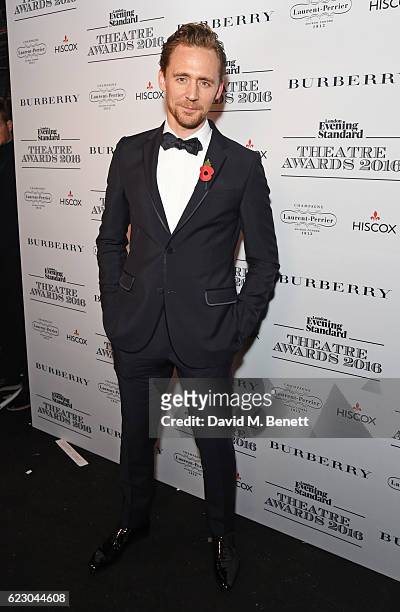 Tom Hiddleston poses in front of the winners boards at The 62nd London Evening Standard Theatre Awards, recognising excellence from across the world...