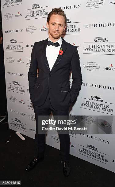 Tom Hiddleston poses in front of the winners boards at The 62nd London Evening Standard Theatre Awards, recognising excellence from across the world...