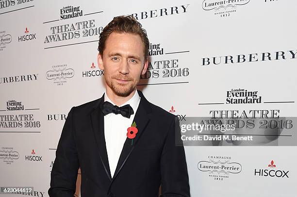 Tom Hiddleston poses in front of the winners boards at The 62nd London Evening Standard Theatre Awards, recognising excellence from across the world...