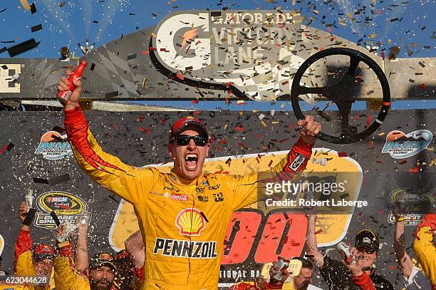 Joey Logano, driver of the Shell Pennzoil Ford, celebrates in Victory Lane after winning the NASCAR Sprint Cup Series Can-Am 500 at Phoenix...