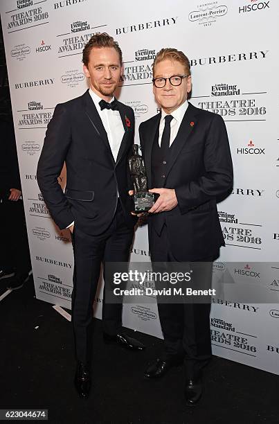 Tom HIddleston and Sir Kenneth Branagh, winner of the Lebedev Award, pose in front of the winners boards at The 62nd London Evening Standard Theatre...