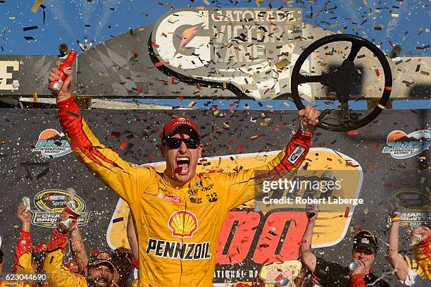 Joey Logano, driver of the Shell Pennzoil Ford, celebrates in Victory Lane after winning the NASCAR Sprint Cup Series Can-Am 500 at Phoenix...