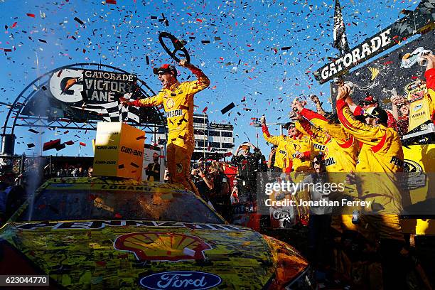 Joey Logano, driver of the Shell Pennzoil Ford, celebrates in Victory Lane after winning the NASCAR Sprint Cup Series Can-Am 500 at Phoenix...