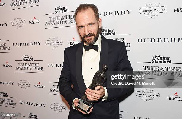 Ralph Fiennes, winner of the Best Actor award, poses in front of the winners boards at The 62nd London Evening Standard Theatre Awards, recognising...