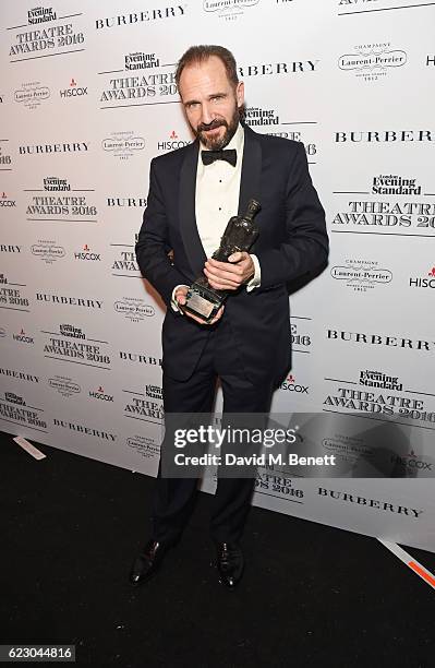 Ralph Fiennes, winner of the Best Actor award, poses in front of the winners boards at The 62nd London Evening Standard Theatre Awards, recognising...