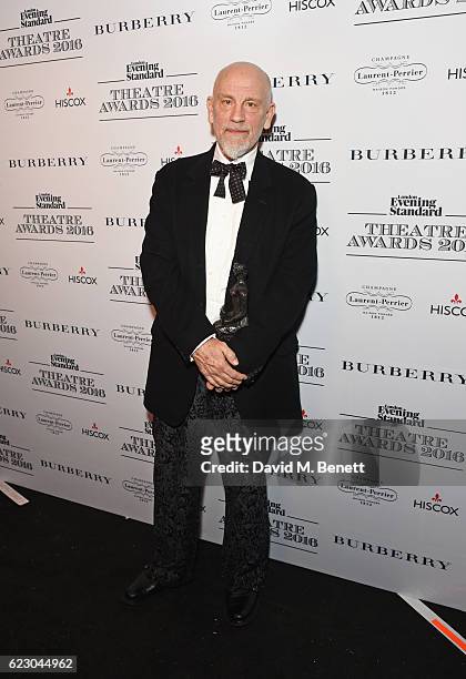 John Malkovich, winner of the Milton Shulman award for Best Director, poses in front of the winners boards at The 62nd London Evening Standard...