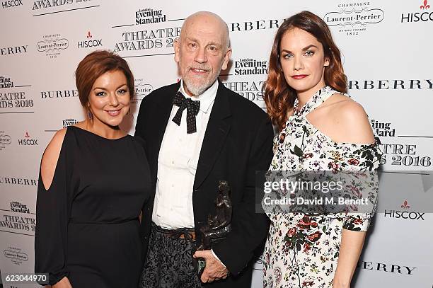 John Malkovich , winner of the Milton Shulman award for Best Director, poses with Sheridan Smith and Ruth Wilson in front of the winners boards at...