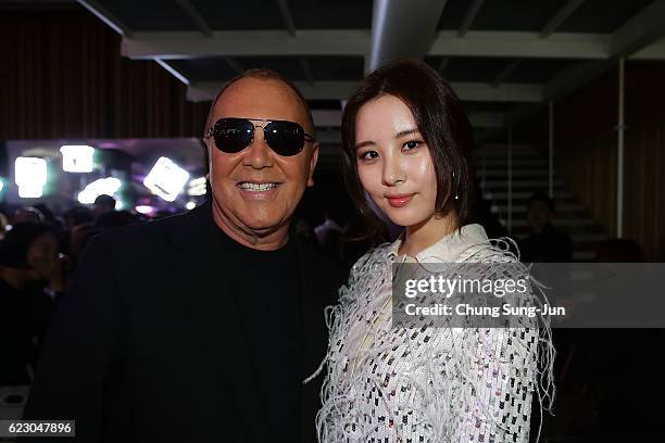 Designer Michael Kors and singer Seo-Hyun attend the Michael Kors Young Korea Party in Seoul on November 12, 2016 in Seoul, South Korea.