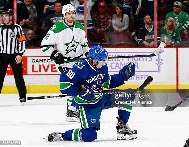 Markus Granlund of the Vancouver Canucks celebrates in front of Dan Hamhuis of the Dallas Stars after scoring in overtime during their NHL game at...