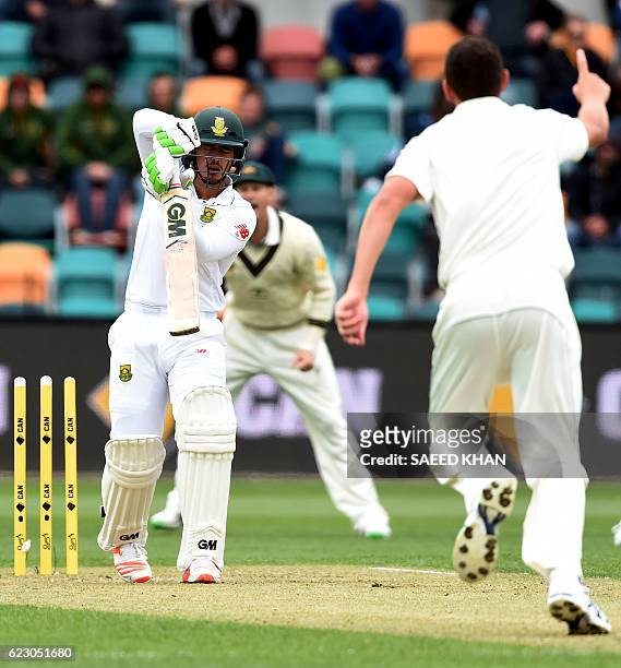 South Africa's batsman Quinton de Kock is clean bowled off Australia's paceman Josh Hazlewood on the third day's play of the second Test cricket...