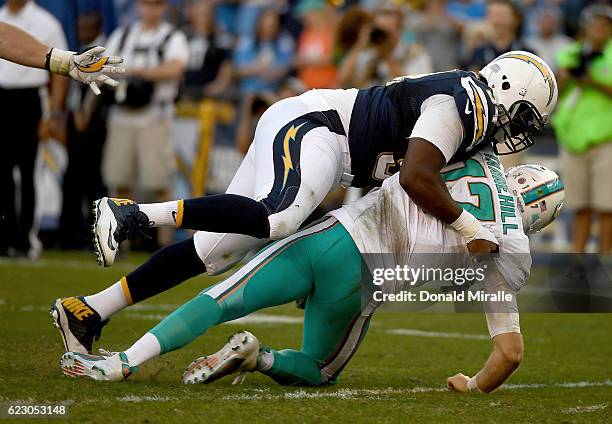 Corey Liuget of the San Diego Chargers pressures Ryan Tannehill of the Miami Dolphins during the second half at Qualcomm Stadium on November 13, 2016...