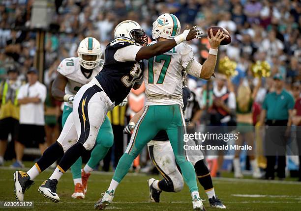 Corey Liuget of the San Diego Chargers hits Ryan Tannehill of the Miami Dolphins during the second half at Qualcomm Stadium on November 13, 2016 in...