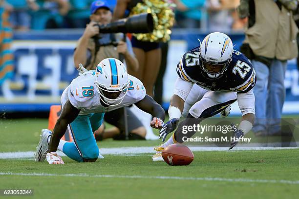 Darrell Stuckey of the San Diego Chargers recovers a fumble by Jakeem Grant of the Miami Dolphins during the second half of a game at Qualcomm...
