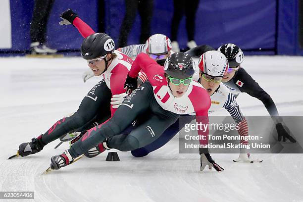 Charle Cournoyer of Canada leads the field as Pascal Dion of Canada and Seungsoo Han of Korea collide in the Men's 1500 meter Semifinal during the...