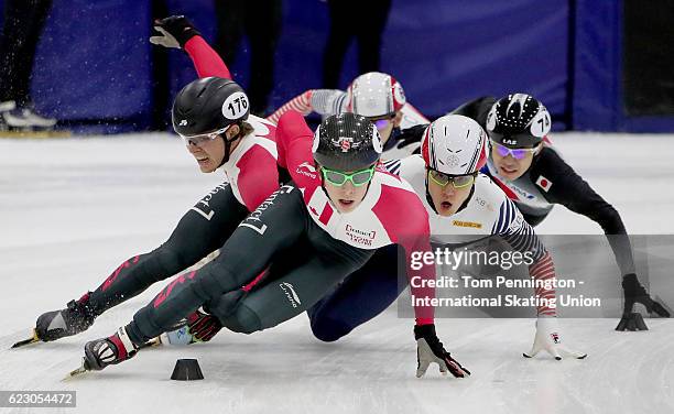 Charle Cournoyer of Canada leads the field as Pascal Dion of Canada and Seungsoo Han of Korea collide in the Men's 1500 meter Semifinal during the...