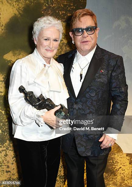 Glenn Close, winner of the Best Musical Performance award, and Sir Elton John pose onstage at the 62nd London Evening Standard Theatre Awards,...
