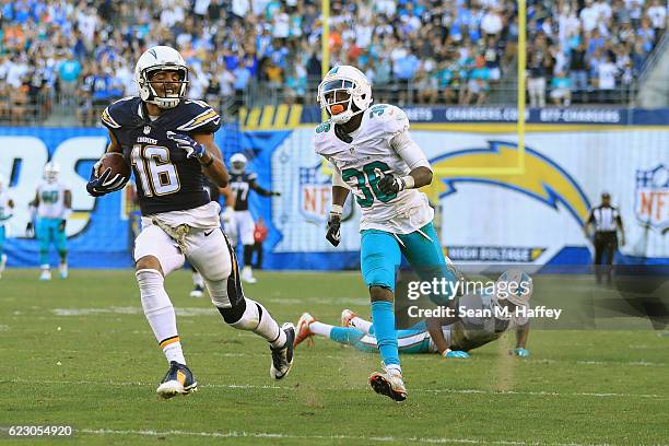 Tyrell Williams of the San Diego Chargers runs for a touchdown on a pass play as Tony Lippett of the Miami Dolphins defends during the second half of...