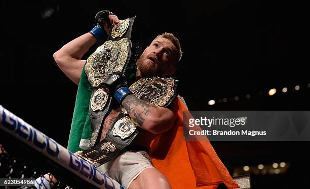 Conor McGregor of Ireland celebrates his victory over Eddie Alvarez in their UFC lightweight championship fight during the UFC 205 event at Madison...