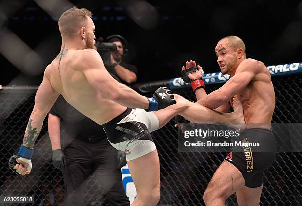 Conor McGregor of Ireland kicks Eddie Alvarez in their UFC lightweight championship fight during the UFC 205 event at Madison Square Garden on...
