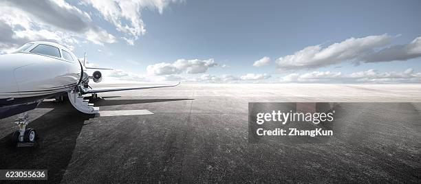 at the airport - private aeroplane stock pictures, royalty-free photos & images