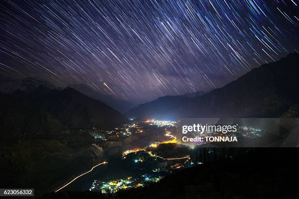 star trail over hunza valley, pakistan - hunza valley stock-fotos und bilder