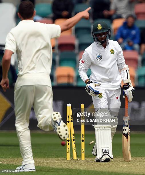 South Africa's batsman Keshav Maharaj is clean bowled off Australia's paceman Josh Hazlewood on the third day's play of the second Test cricket match...