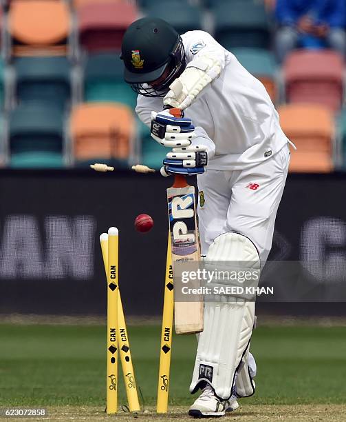 South Africa's batsman Keshav Maharaj is clean bowled off Australia's paceman Josh Hazlewood on the third day's play of the second Test cricket match...