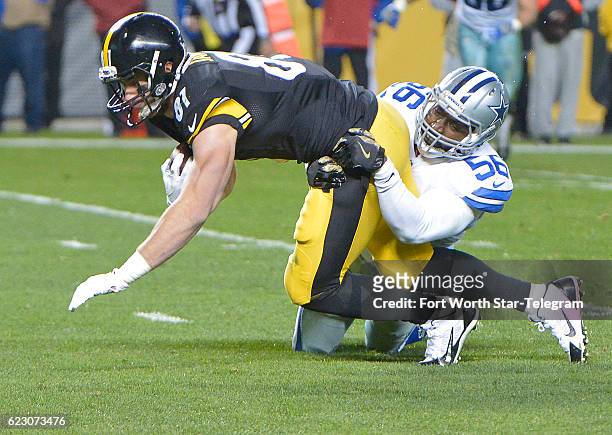 Dallas Cowboys linebacker Justin Durant stops Pittsburgh Steelers tight end Jesse James on the one yard line during the fourth quarter on Sunday,...