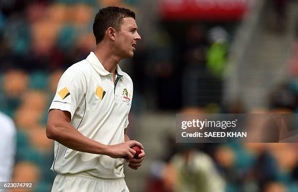 Australia's paceman Josh Hazlewood gets ready to bowl on the third day's play of the second Test cricket match between Australia and South Africa in...