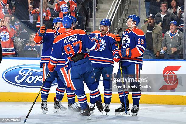 Ryan Nugent-Hopkins, Connor McDavid, Andrej Sekera and Tyler Pitlick of the Edmonton Oilers celebrate after a goal during the game against the New...