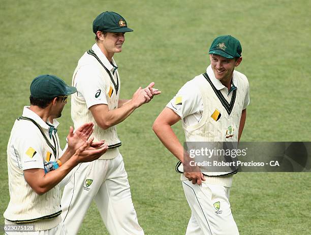 Josh Hazlewood of Australia is congratulated by team-mates after claiming his sixth wicket of the innings during day three of the Second Test match...