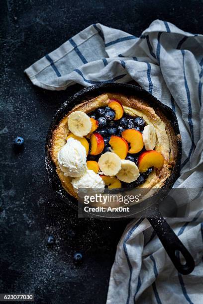 dutch baby pancake with fruits and ice cream - blueberry pancakes stock pictures, royalty-free photos & images