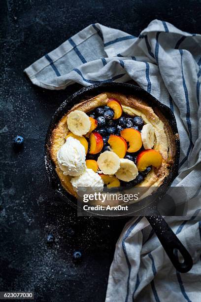 dutch baby pancake with fruits and ice cream - blueberry pancakes bildbanksfoton och bilder