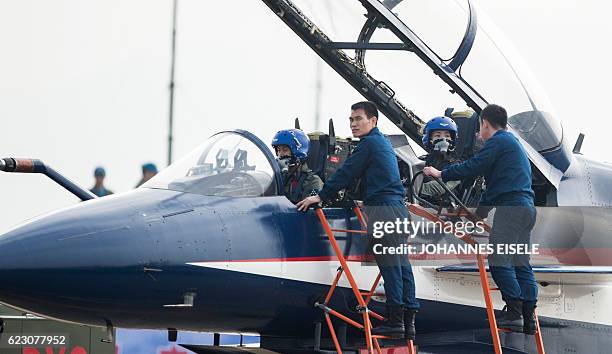 This picture taken on November 11, 2014 shows Chinese female J-10 fighter pilot Yu Xu getting ready to perform at the Airshow China in Zhuhai, south...