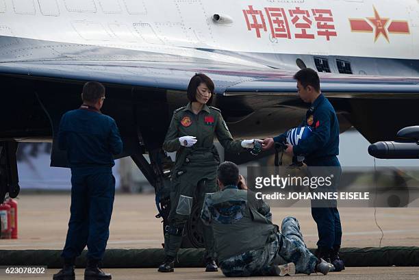 This picture taken on November 11, 2014 shows Chinese female J-10 fighter pilot Yu Xu getting ready to perform at the Airshow China in Zhuhai, south...