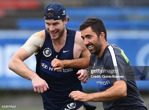 Bryce Gibbs and Kade Simpson of the Blues run whilst bumping into each other during the Carlton Blues AFL pre-season training session at Ikon Park on...