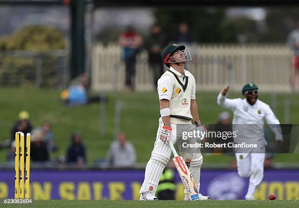 David Warner of Australia reacts after he was bolwed by Kyle Abbott of South Africa during day three of the Second Test match between Australia and...