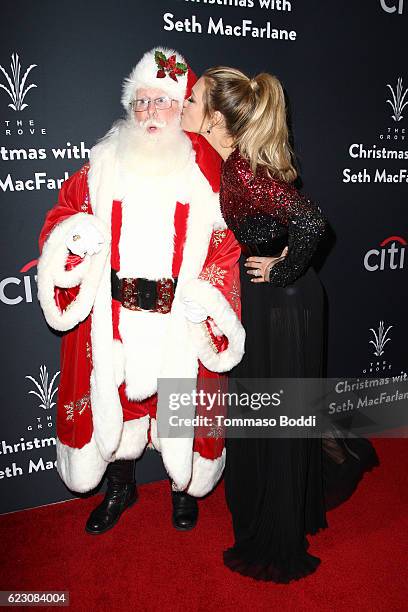 Rachel Platten poses with Santa Claus at The Grove Christmas With Seth MacFarlane at The Grove on November 13, 2016 in Los Angeles, California.