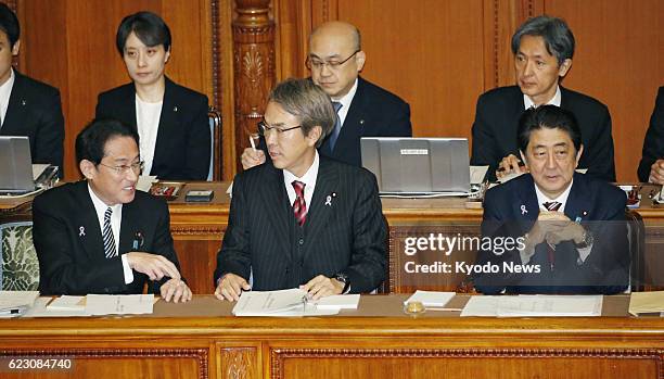 Foreign Minister Fumio Kishida, Economic and Fiscal Policy Minister Nobuteru Ishihara and Prime Minister Shinzo Abe attend the upper house...