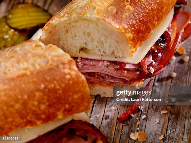 italian sandwich with salami,genoa, prosciutto, provolone and red peppers - submarine sandwich imagens e fotografias de stock