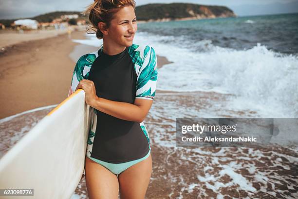 smiling surfer girl - girl wet stock pictures, royalty-free photos & images