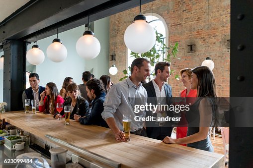 People having drinks at a restaurant People having drinks at a restaurant