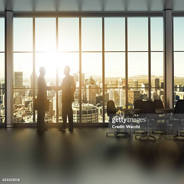 businessman shaking hands - white collar worker dawn light stock pictures, royalty-free photos & images