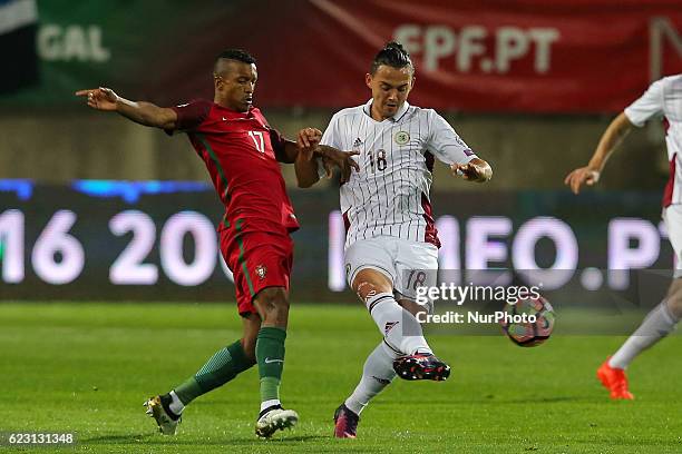 Portugals forward Nani and Latvia's defender Igor Tarasov from Latvia during the 2018 FIFA World Cup Qualifiers matches between Portugal and Latvia...