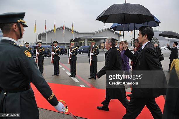German President Joachim Gauck and German First Lady Daniela Schadt are welcomed by official welcoming ceremony after their arrival at Haneda airport...